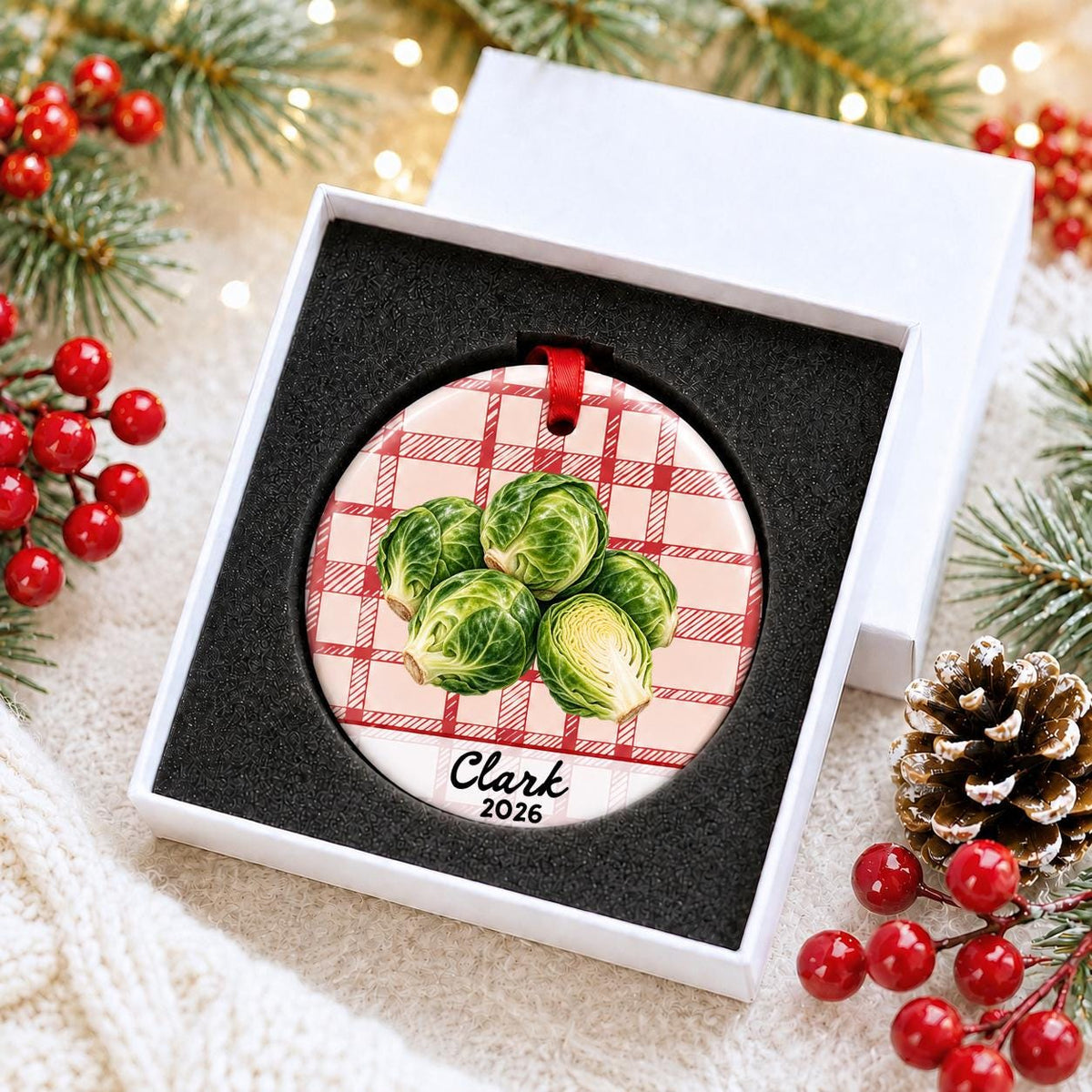 Personalized brussels sprouts ceramic ornament with name and year on red plaid in a white gift box with protective foam
