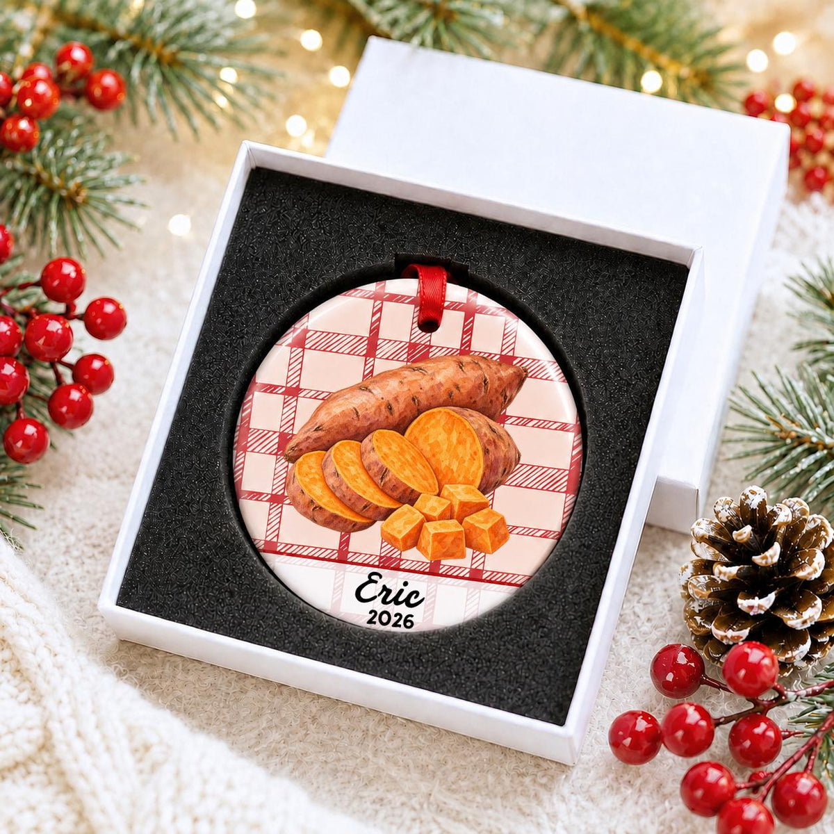 Personalized sweet potato ceramic ornament with name and year on red plaid in a white gift box with protective foam