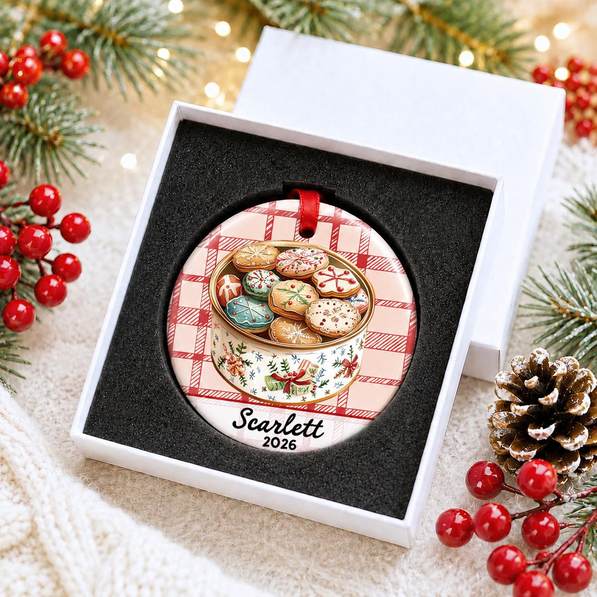 Personalized Christmas cookie tin ceramic ornament with name and year on red plaid in a white gift box with protective foam