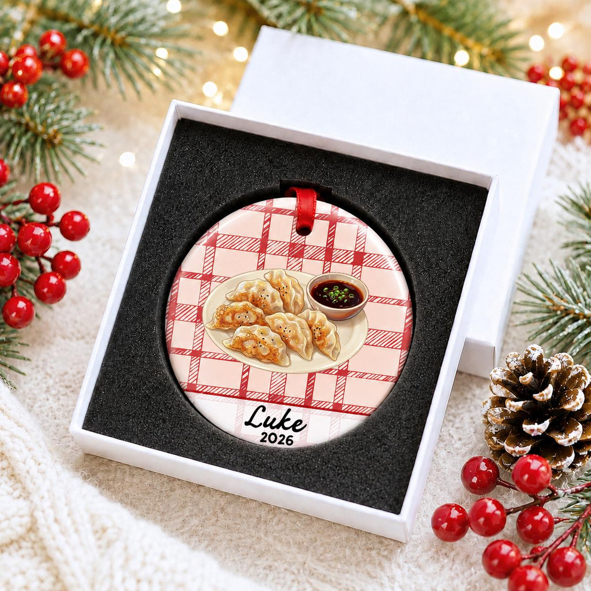 Personalized potsticker ceramic ornament with name and year on red plaid in a white gift box with protective foam