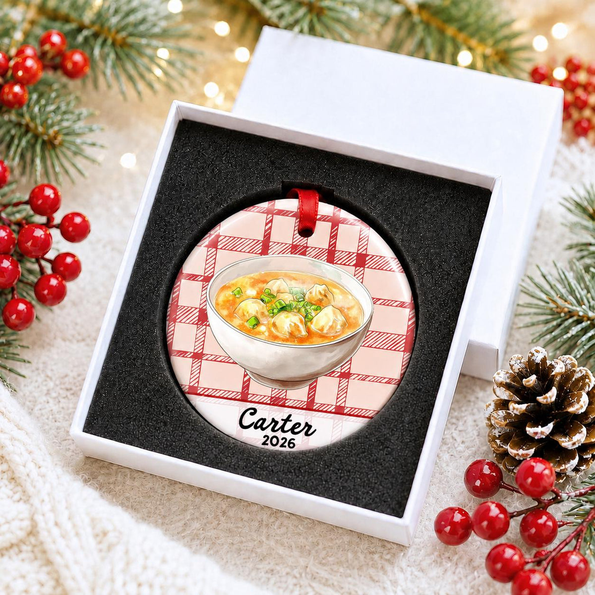 Personalized wonton soup ceramic ornament with name and year on red plaid in a white gift box with protective foam