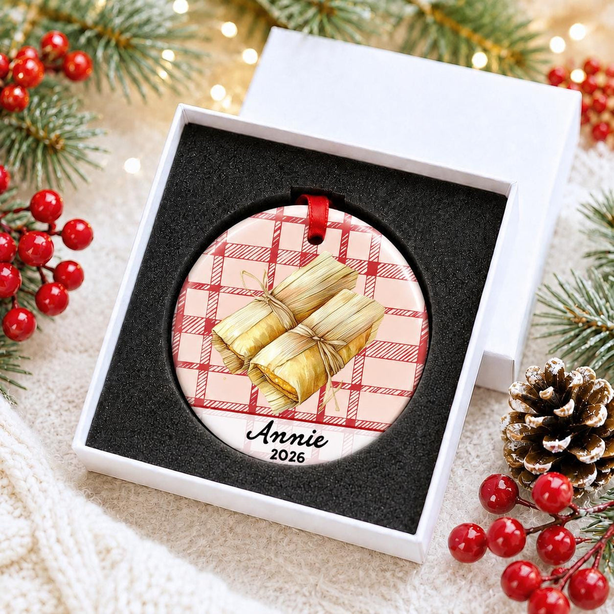Personalized tamale ceramic ornament with name and year on red plaid in a white gift box with protective foam