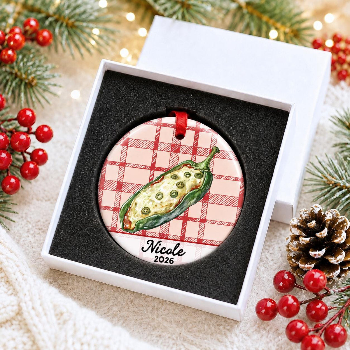Personalized chile relleno ceramic ornament with name and year on red plaid in a white gift box with protective foam