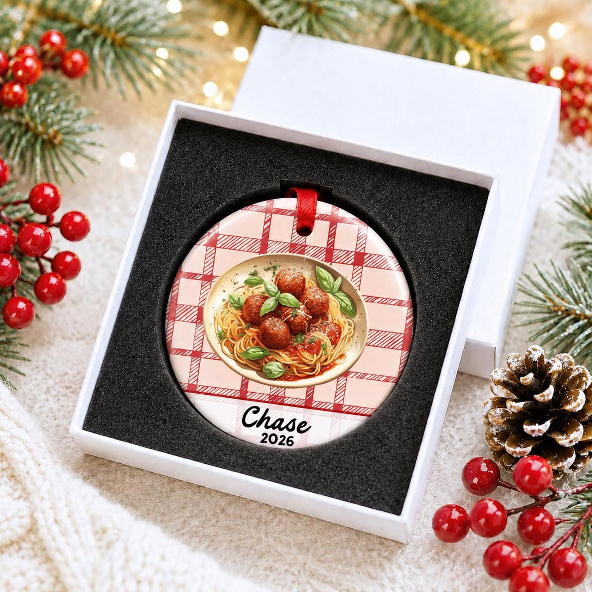 Personalized spaghetti and meatballs ceramic ornament with name and year on red plaid in a white gift box with protective foam