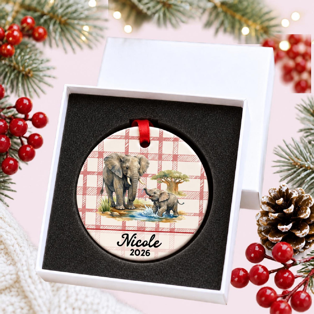Personalized African elephant ceramic ornament with name and year on red plaid in a white gift box with protective foam