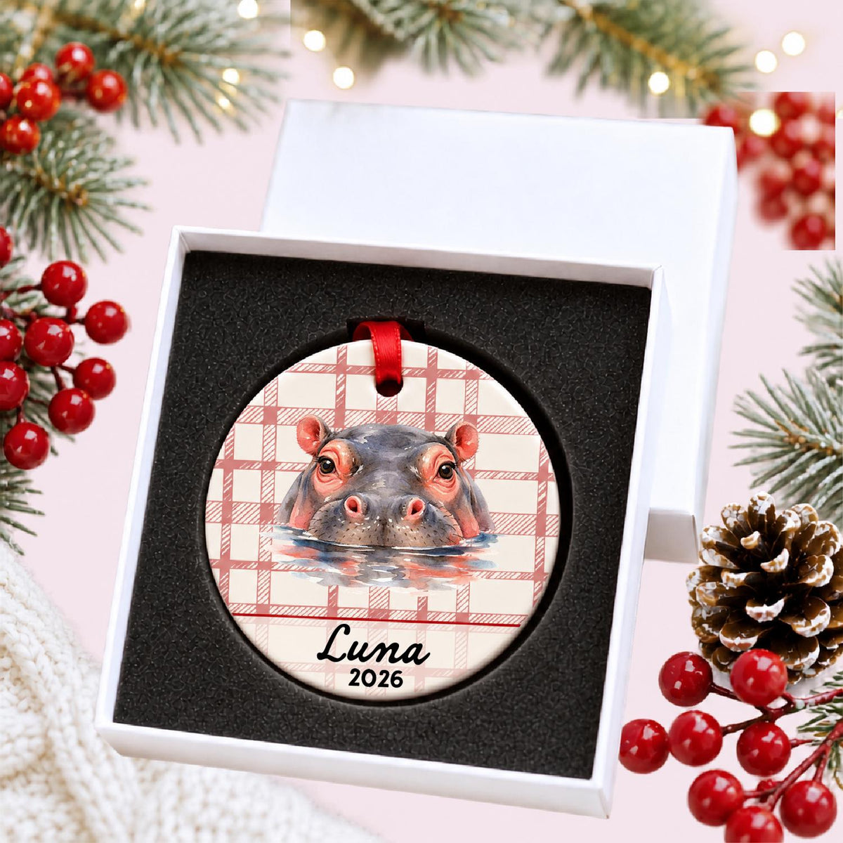 Personalized hippopotamus ceramic ornament with name and year on red plaid in a white gift box with protective foam