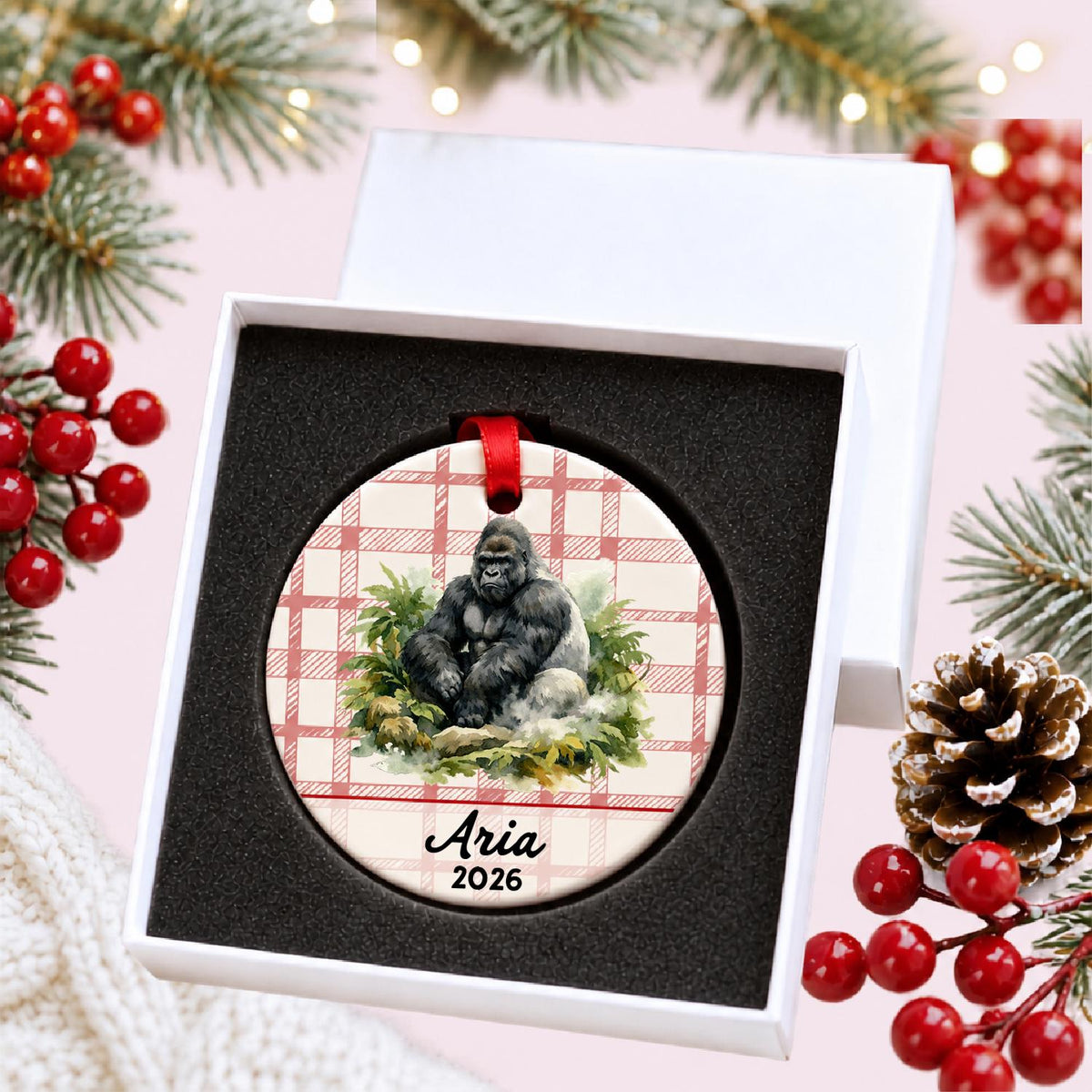 Personalized silverback gorilla ceramic ornament with name and year on red plaid in a white gift box with protective foam