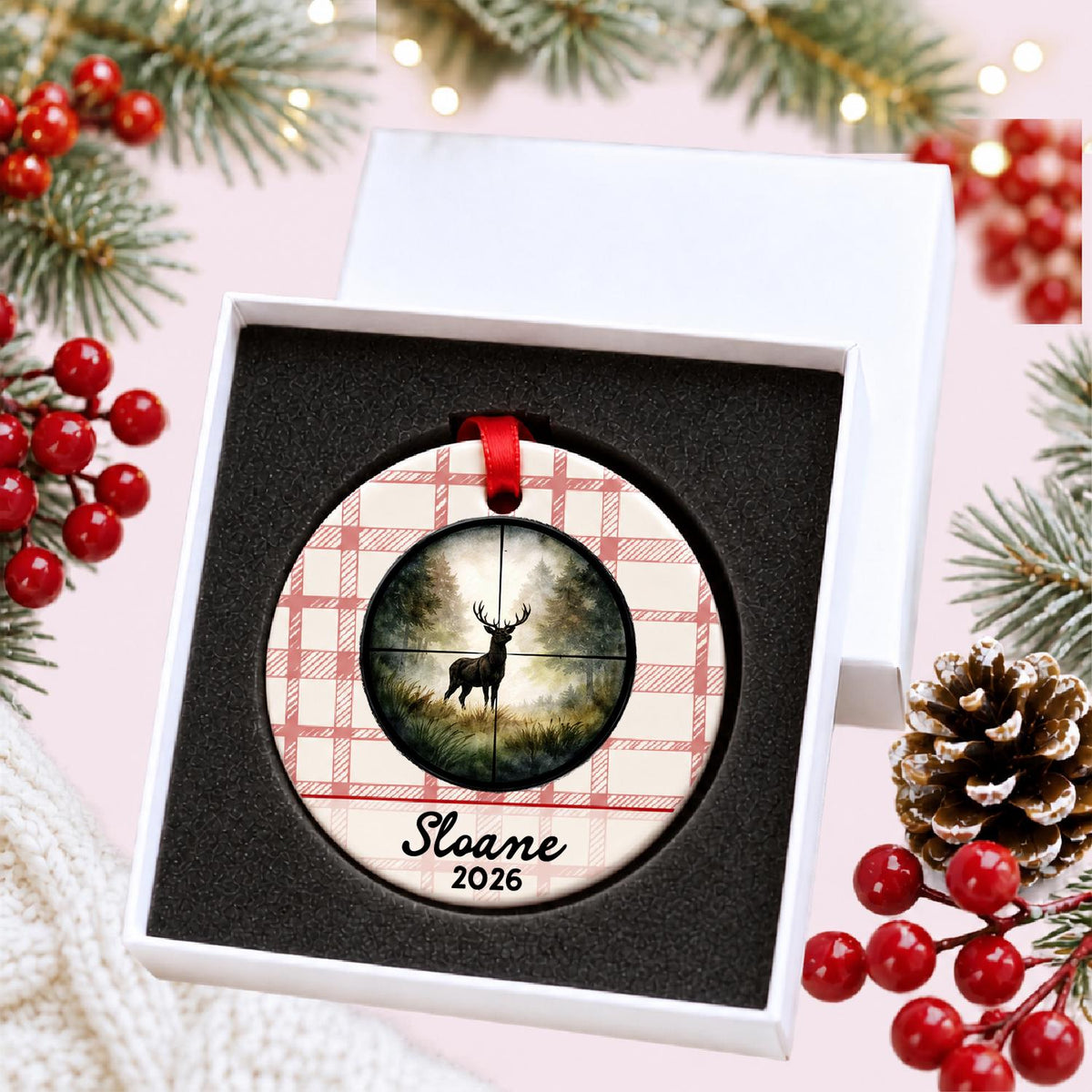 Personalized deer hunting ceramic ornament with name and year on red plaid in a white gift box with protective foam