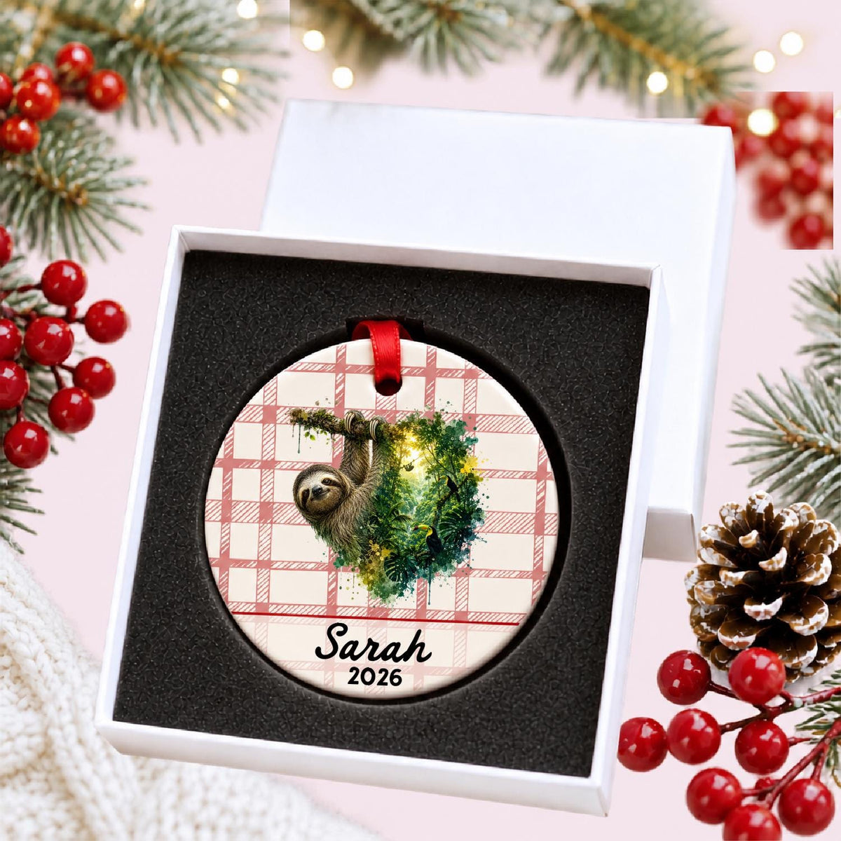 Personalized sloth ceramic ornament with name and year on red plaid in a white gift box with protective foam