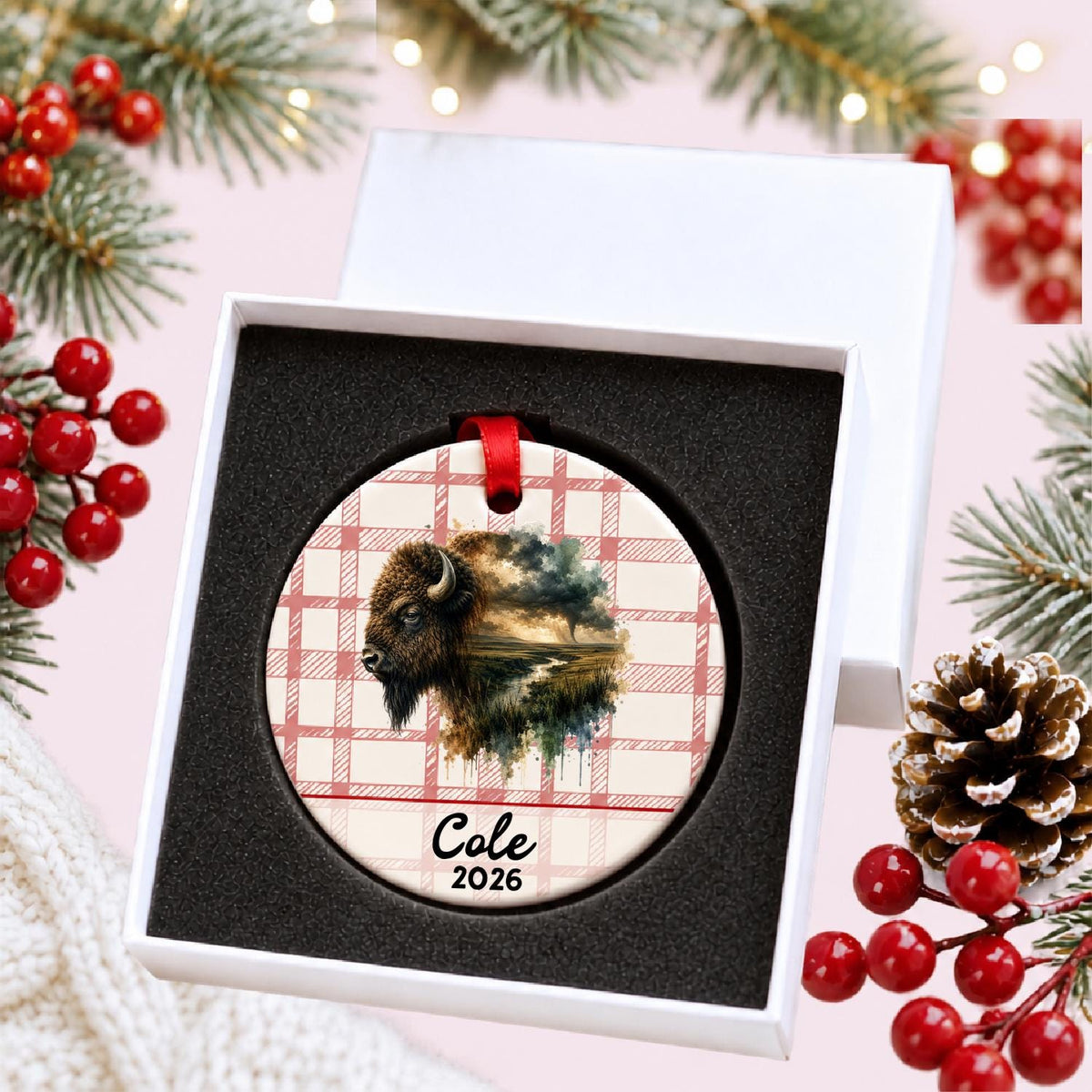 Personalized american bison ceramic ornament with name and year on red plaid in a white gift box with protective foam