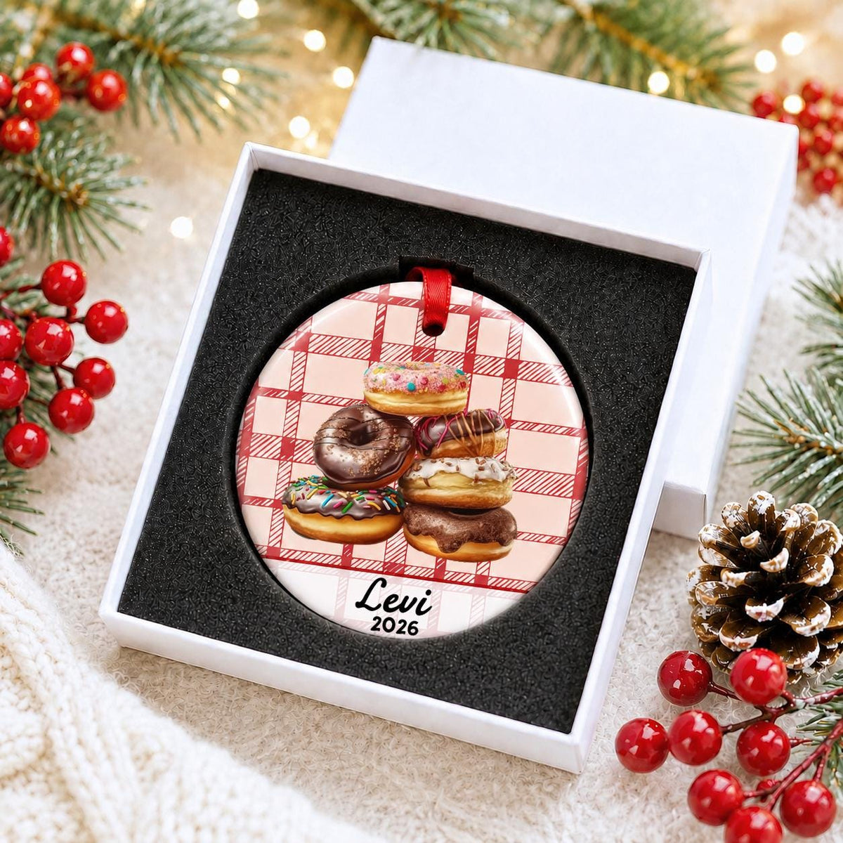 Personalized donuts ceramic ornament with name and year on red plaid in a white gift box with protective foam