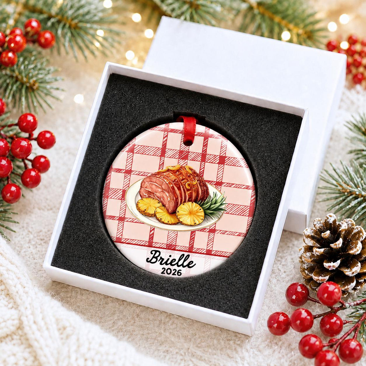 Personalized Christmas ham ceramic ornament with name and year on red plaid in a white gift box with protective foam