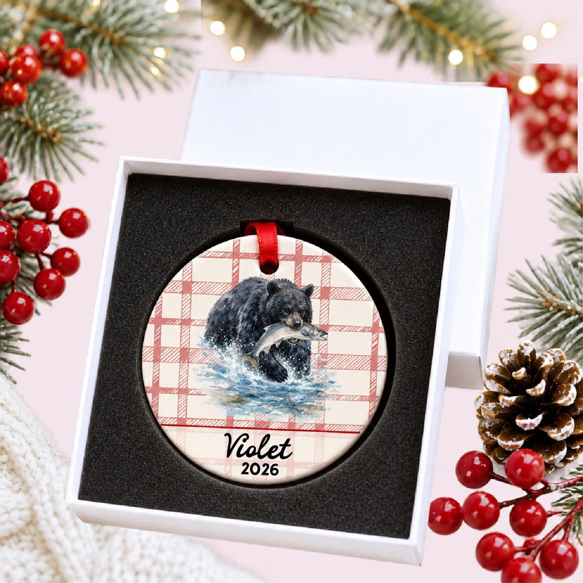 Personalized American black bear ceramic ornament with name and year on red plaid in a white gift box with protective foam