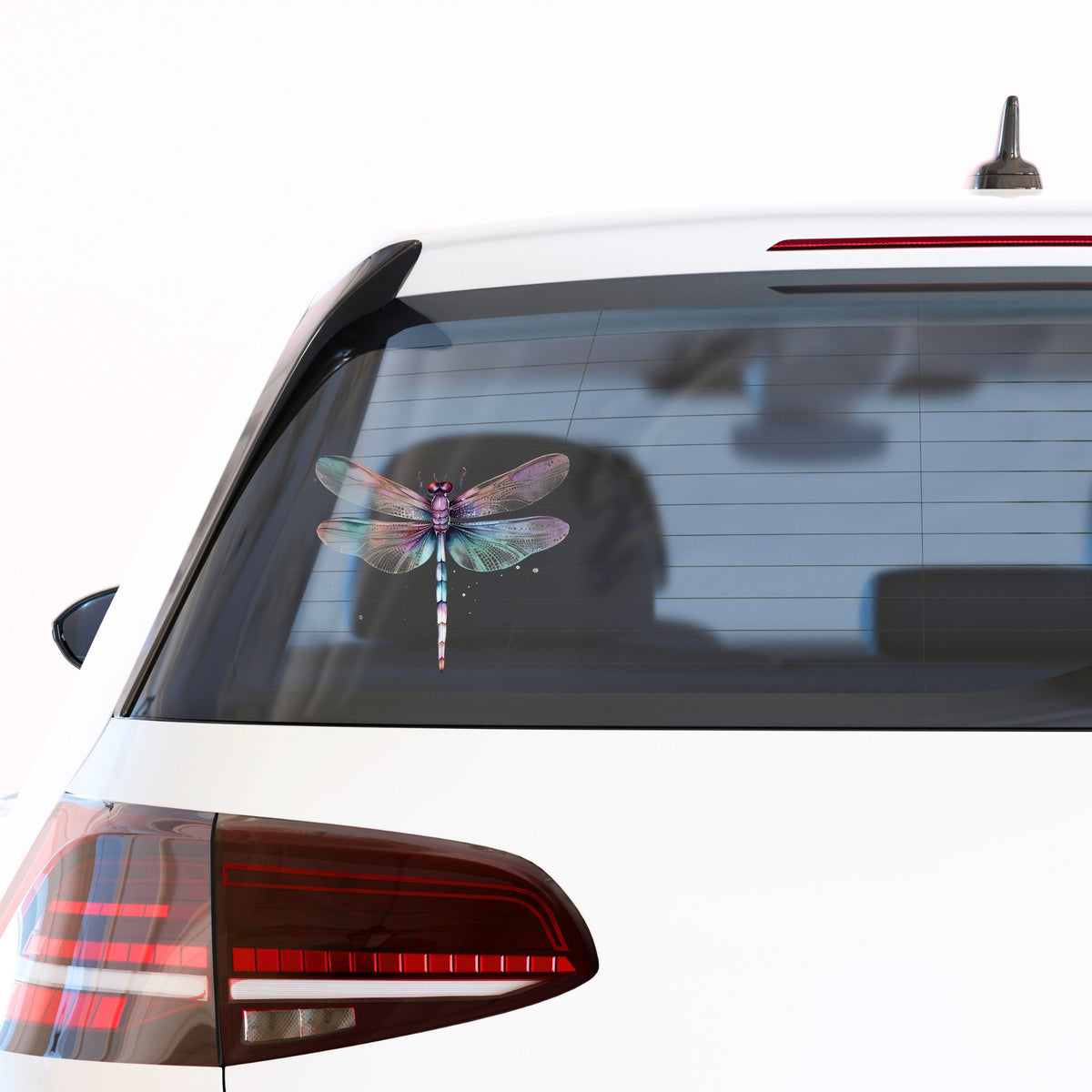 Pastel dragonfly UV DTF decal applied to a car window
