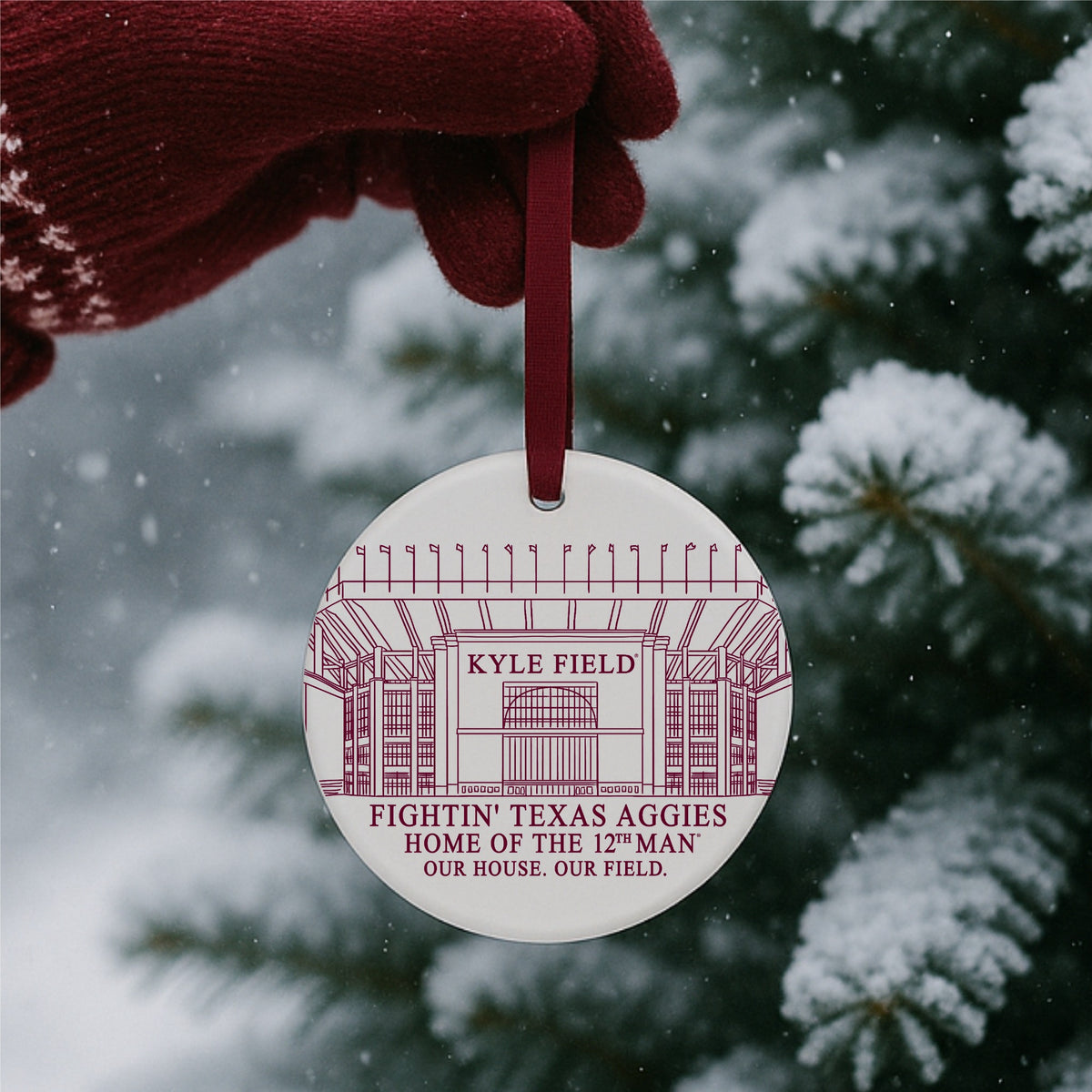 Texas A&M Kyle Field ceramic ornament with maroon ribbon on white background