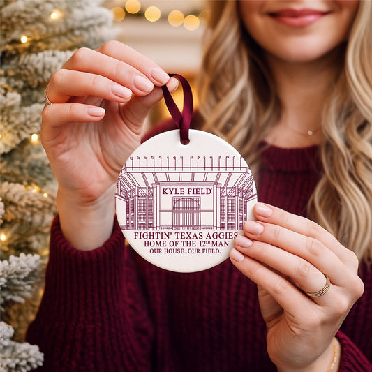 Texas A&M Kyle Field ornament held in front of a Christmas tree