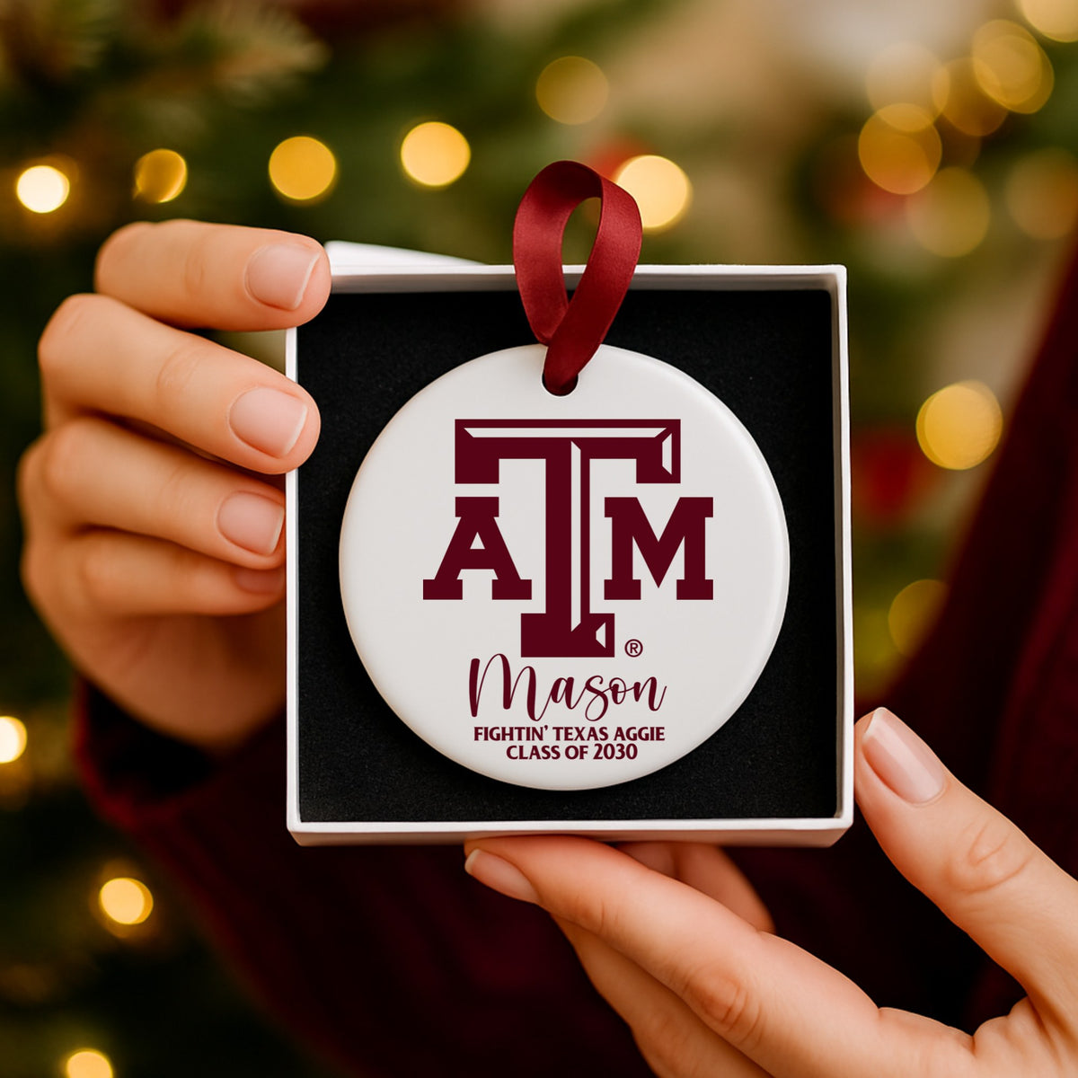 Texas A&M ceramic ornament in white gift box with maroon satin ribbon