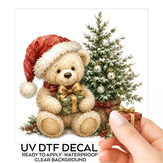 Christmas teddy bear UV DTF sticker shown as a hand-held transfer