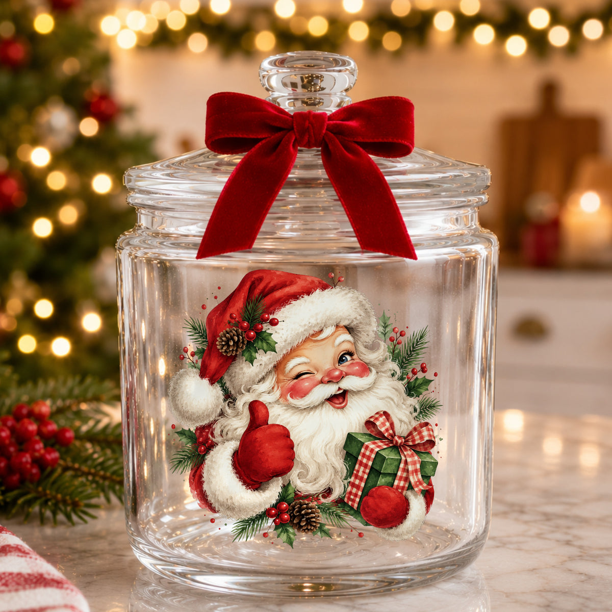 Winking Santa Claus With Gift UV DTF sticker applied to a glass candy jar tied with a red bow