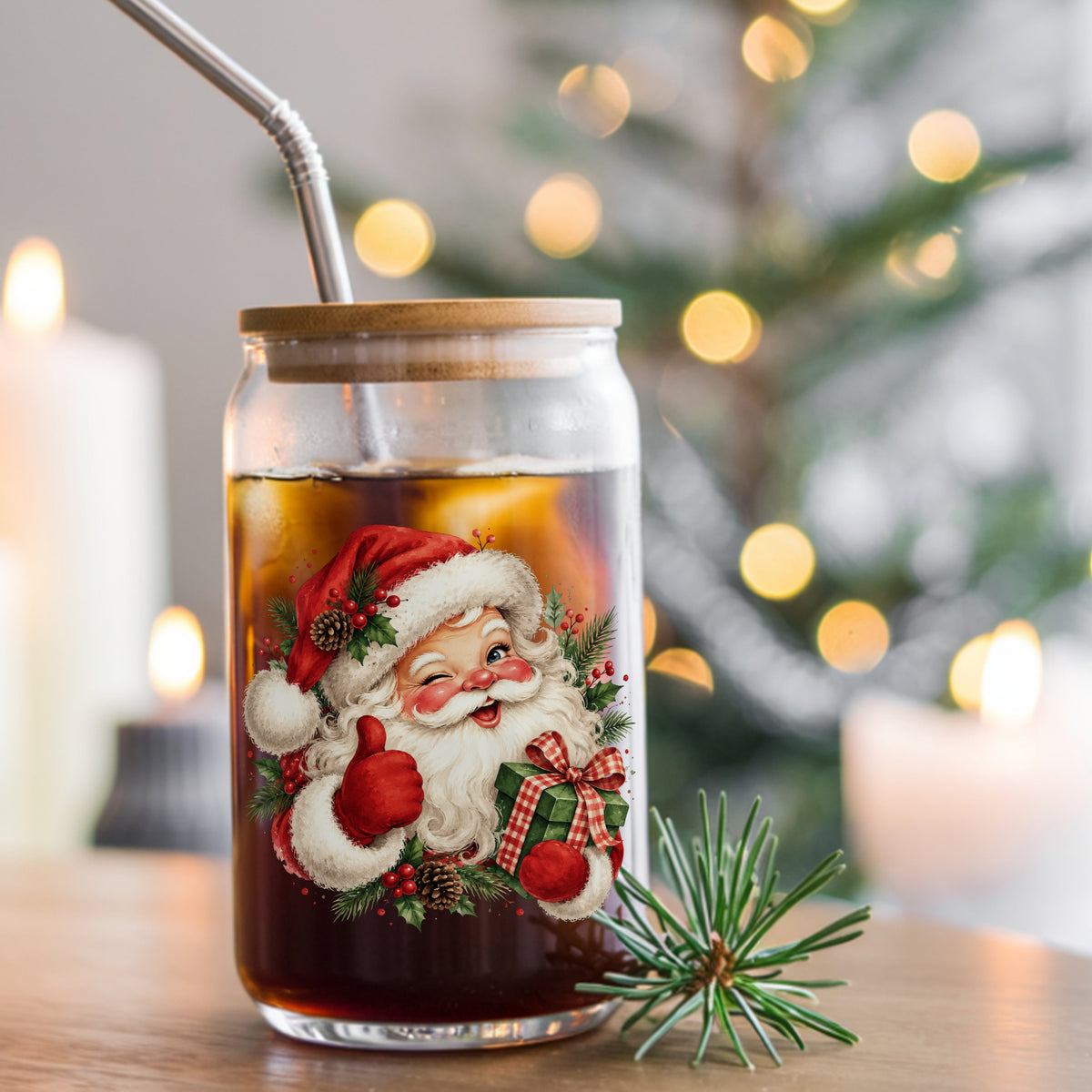 Winking Santa Claus With Gift UV DTF sticker applied to a glass can cup of iced coffee with a straw