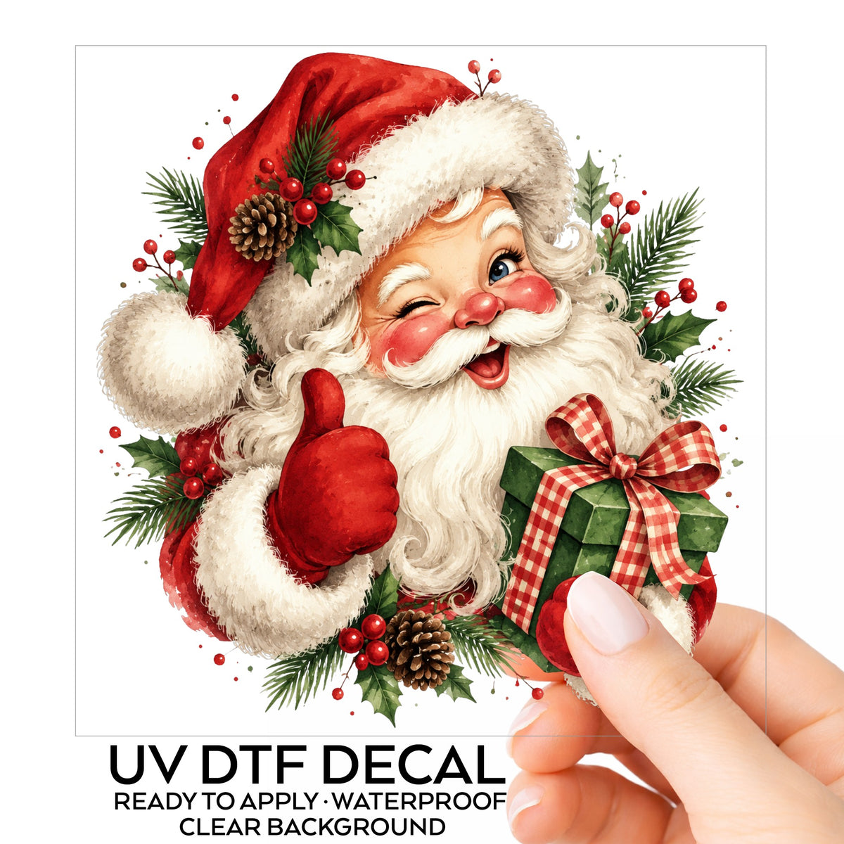 Winking Santa Claus With Gift UV DTF sticker on its backing card, held in hand