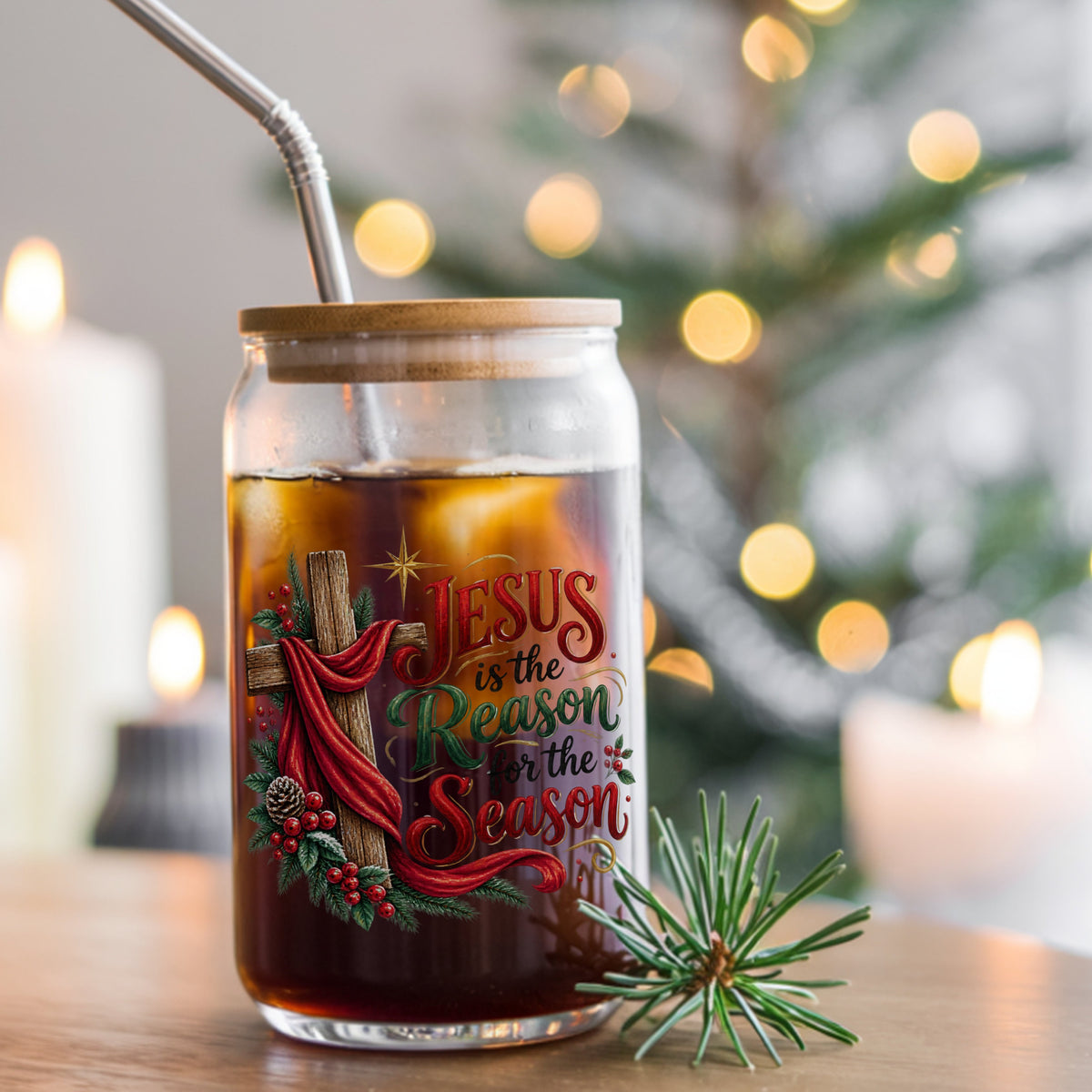 Jesus Is The Reason For The Season Cross UV DTF sticker applied to a glass can cup of iced coffee with a straw