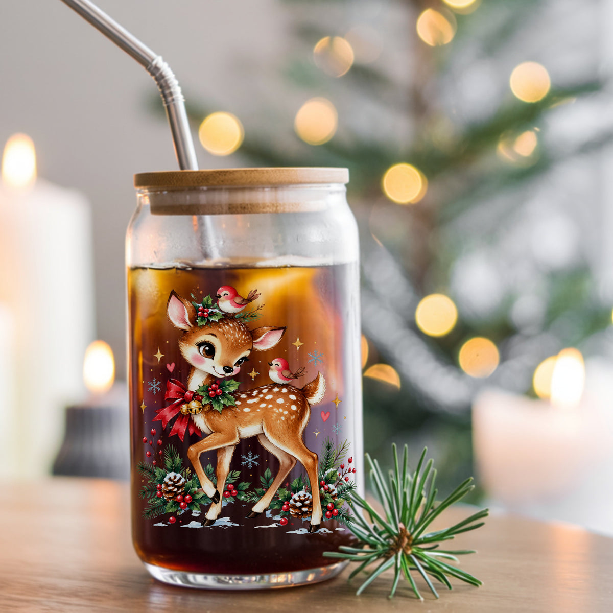 Christmas Deer With Red Cardinals UV DTF sticker applied to a glass can cup of iced coffee with a straw