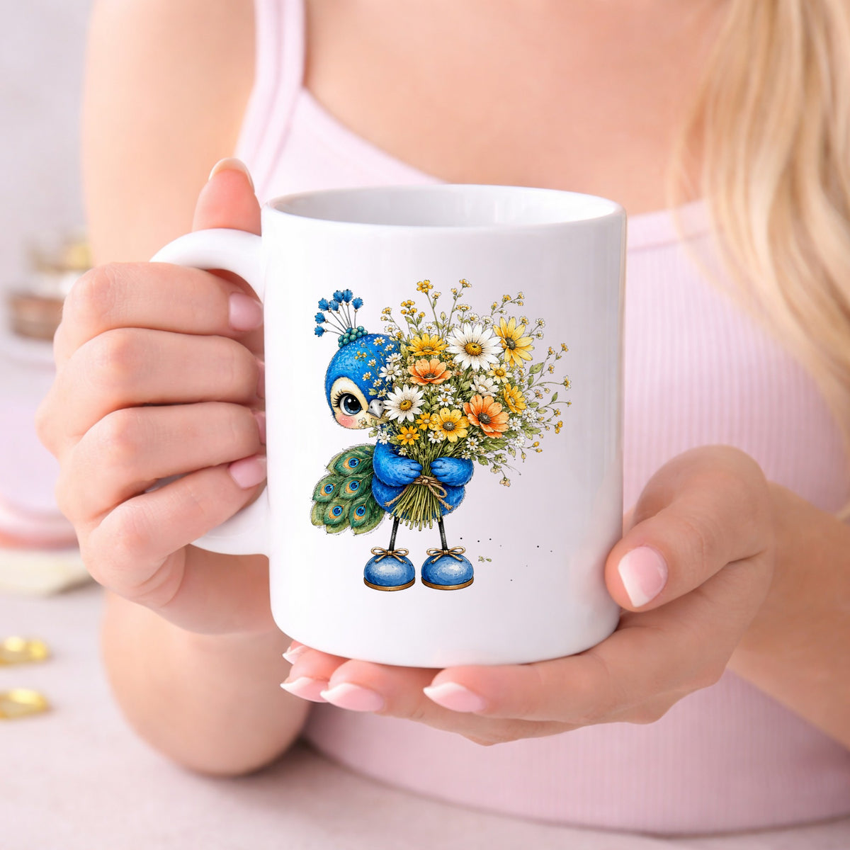 Peacock Holding Wildflower Bouquet UV DTF sticker applied to a white coffee mug held in both hands