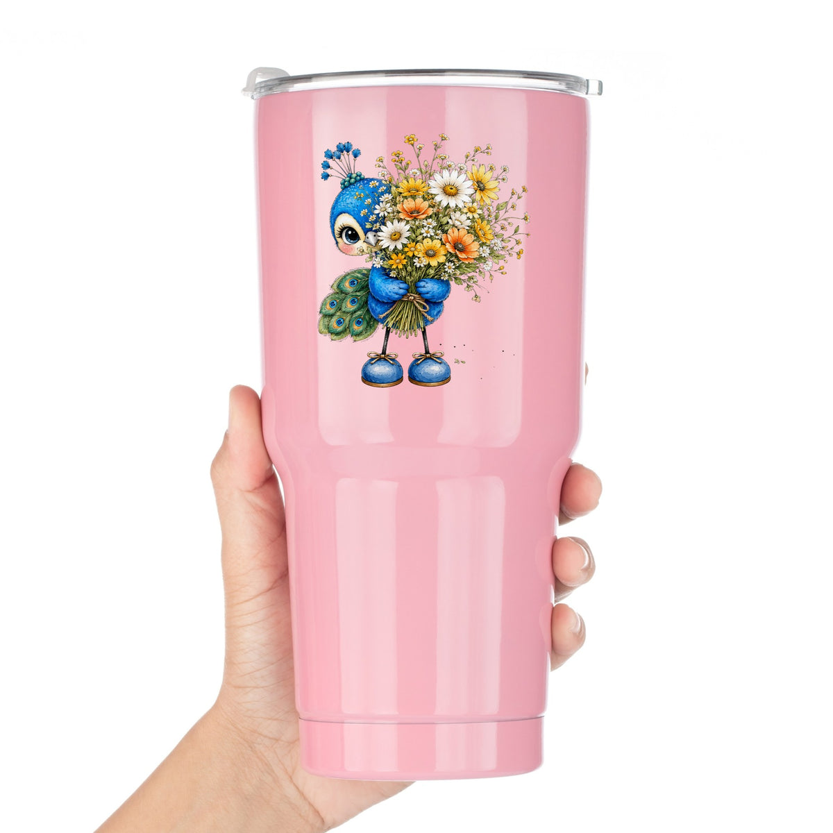 Peacock Holding Wildflower Bouquet UV DTF sticker applied to a pink tumbler held against a white background