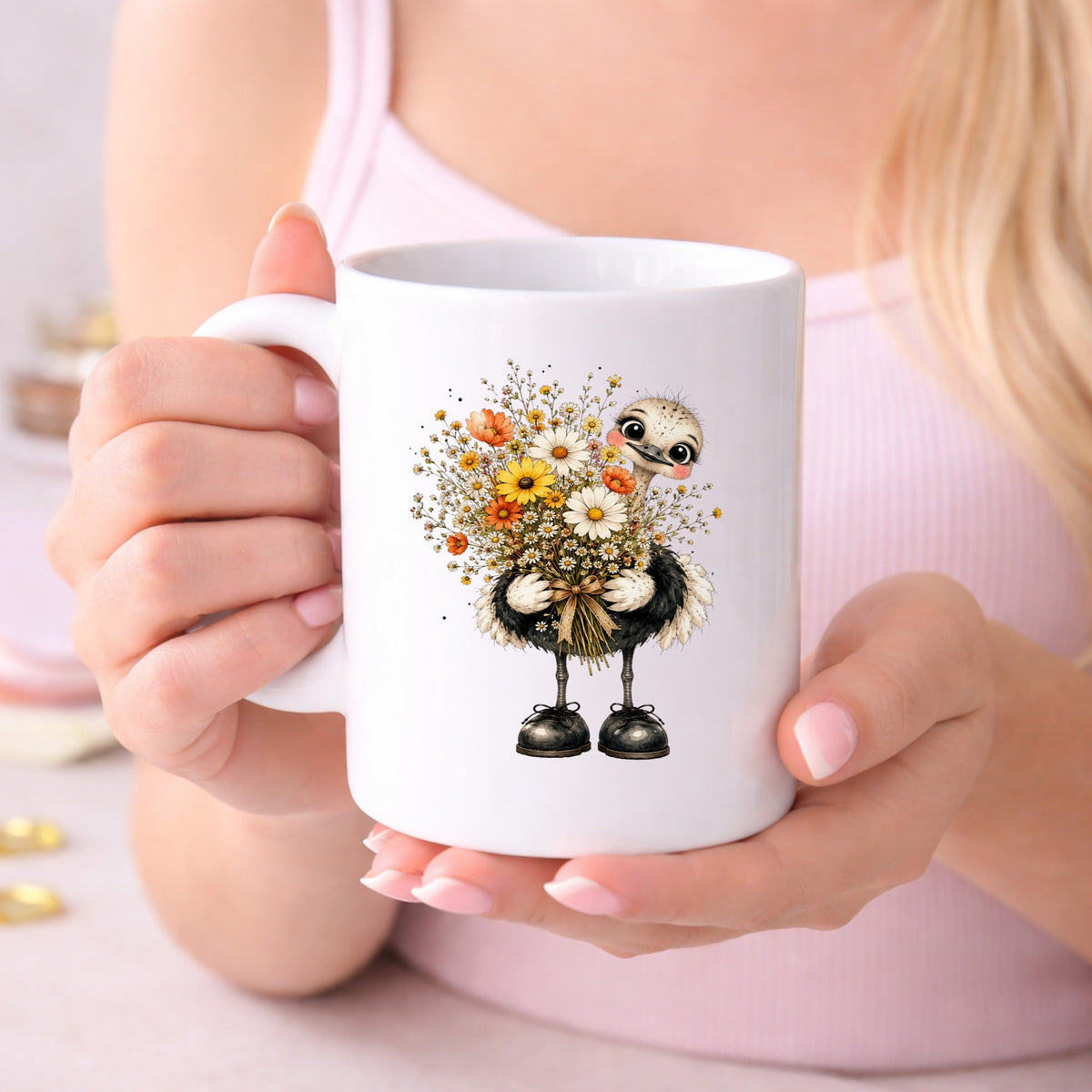 Ostrich Holding Daisy Bouquet UV DTF sticker applied to a white coffee mug held in both hands