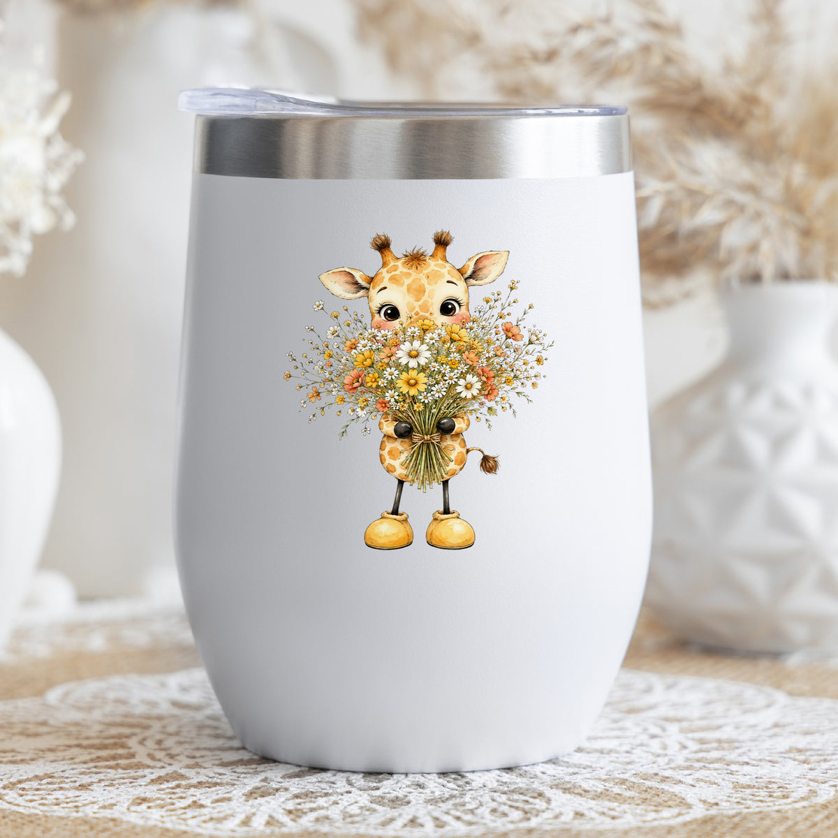 Baby Giraffe Holding Wildflower Bouquet UV DTF sticker applied to a white stemless tumbler with a lid