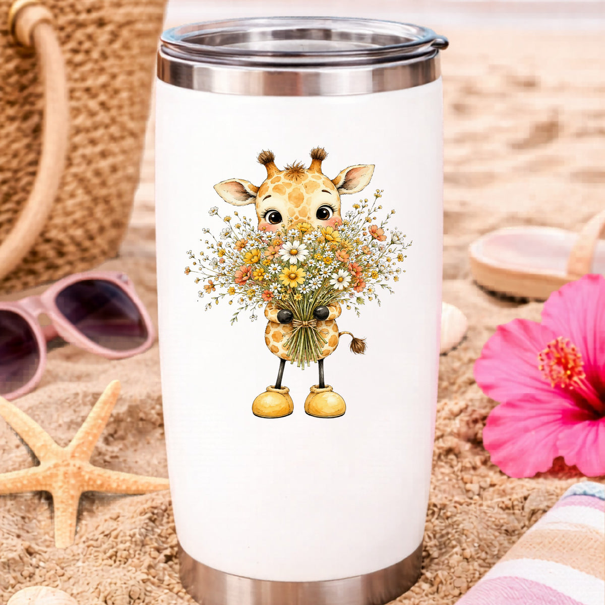 Baby Giraffe Holding Wildflower Bouquet UV DTF sticker applied to a white travel tumbler on beach sand