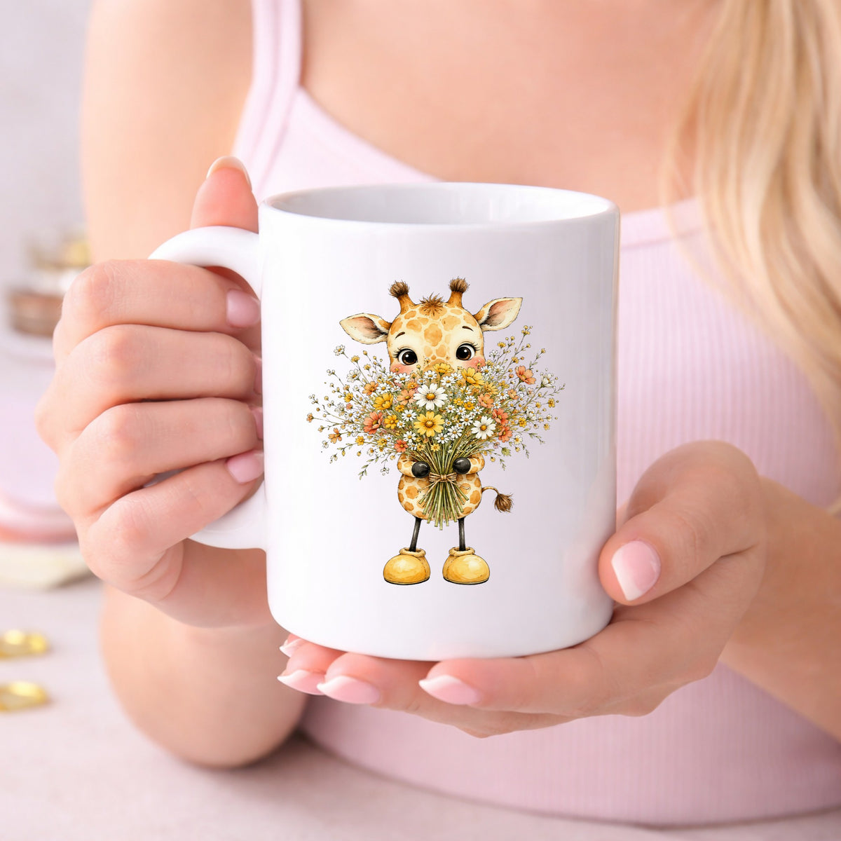 Baby Giraffe Holding Wildflower Bouquet UV DTF sticker applied to a white coffee mug held in both hands