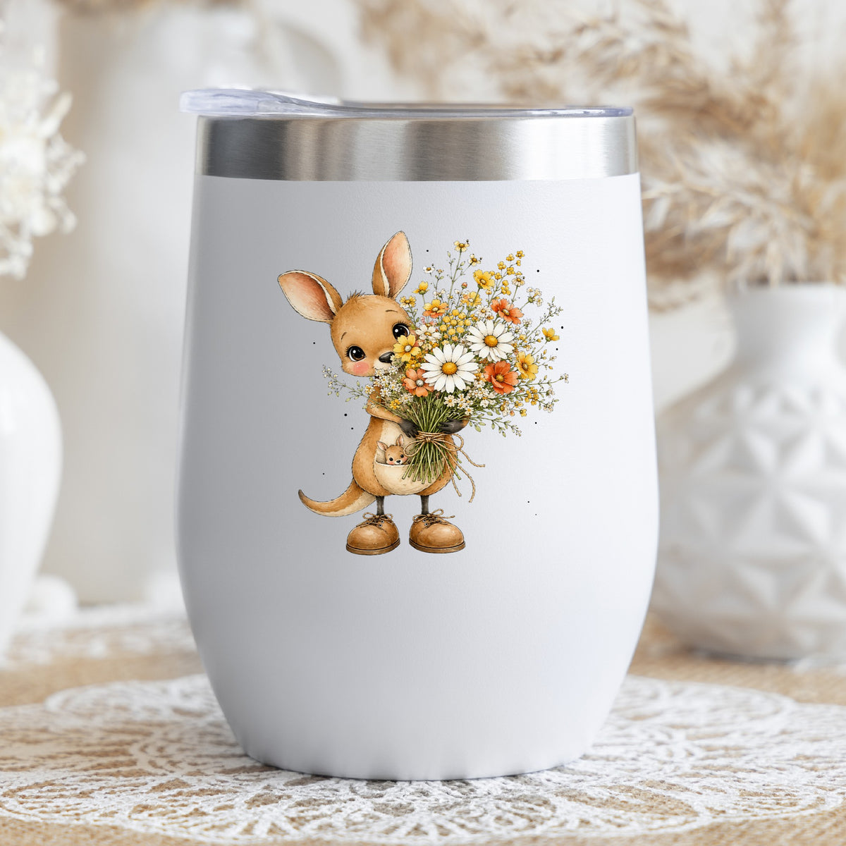 Kangaroo Holding Daisy Bouquet UV DTF sticker applied to a white stemless tumbler with a lid