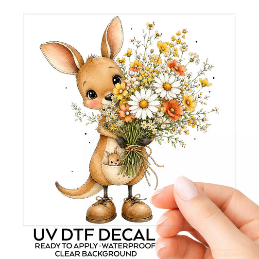 Kangaroo Holding Daisy Bouquet UV DTF sticker on its backing card, held in hand