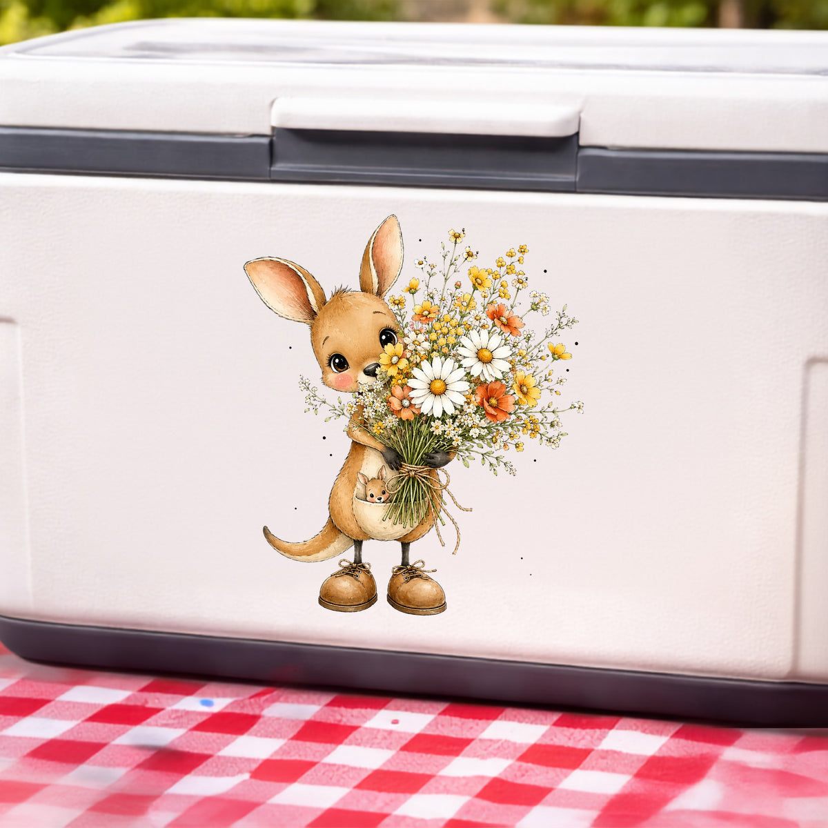 Kangaroo Holding Daisy Bouquet UV DTF sticker applied to a white cooler on a red gingham cloth