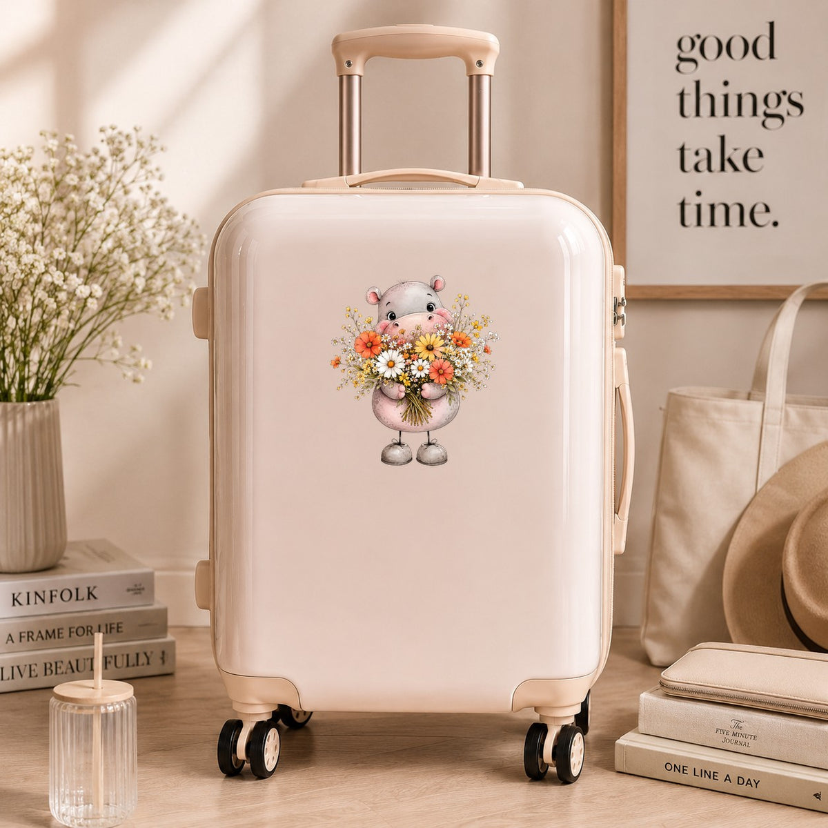 Pink Hippo Holding Wildflower Bouquet UV DTF sticker applied to a cream carry-on suitcase