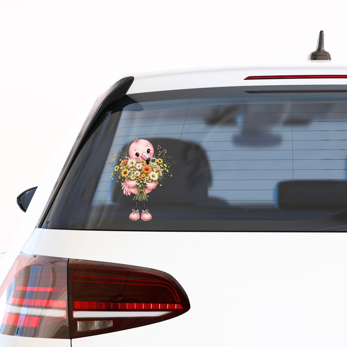 Pink Flamingo Holding Flower Bouquet UV DTF sticker applied to the rear window of a white car