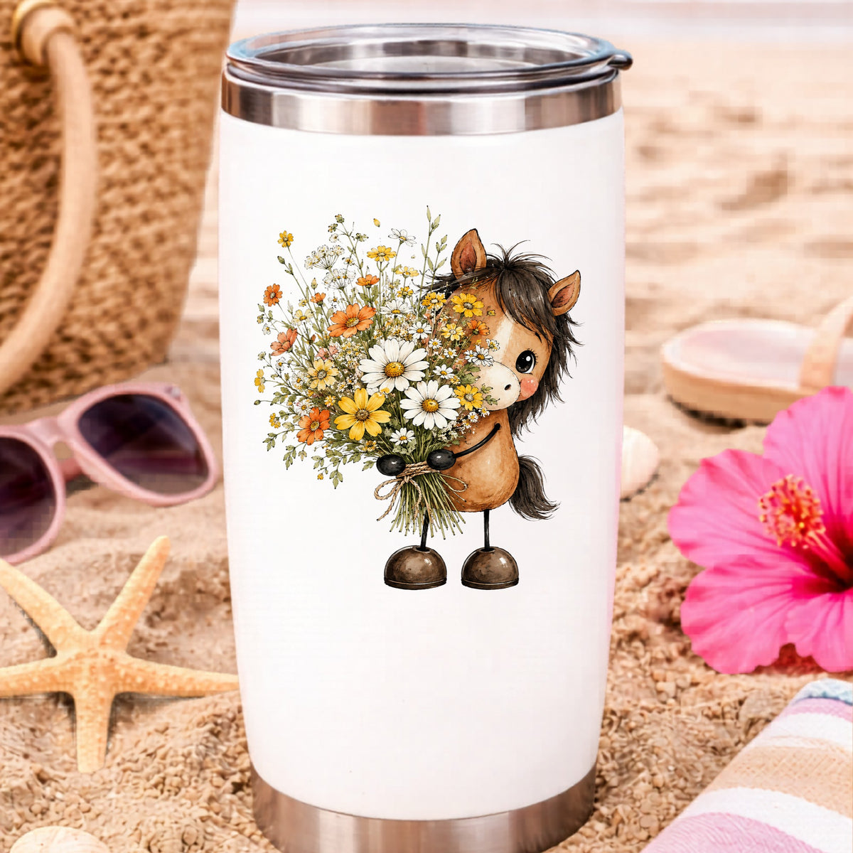 Brown Horse Holding Wildflower Bouquet UV DTF sticker applied to a white travel tumbler on beach sand
