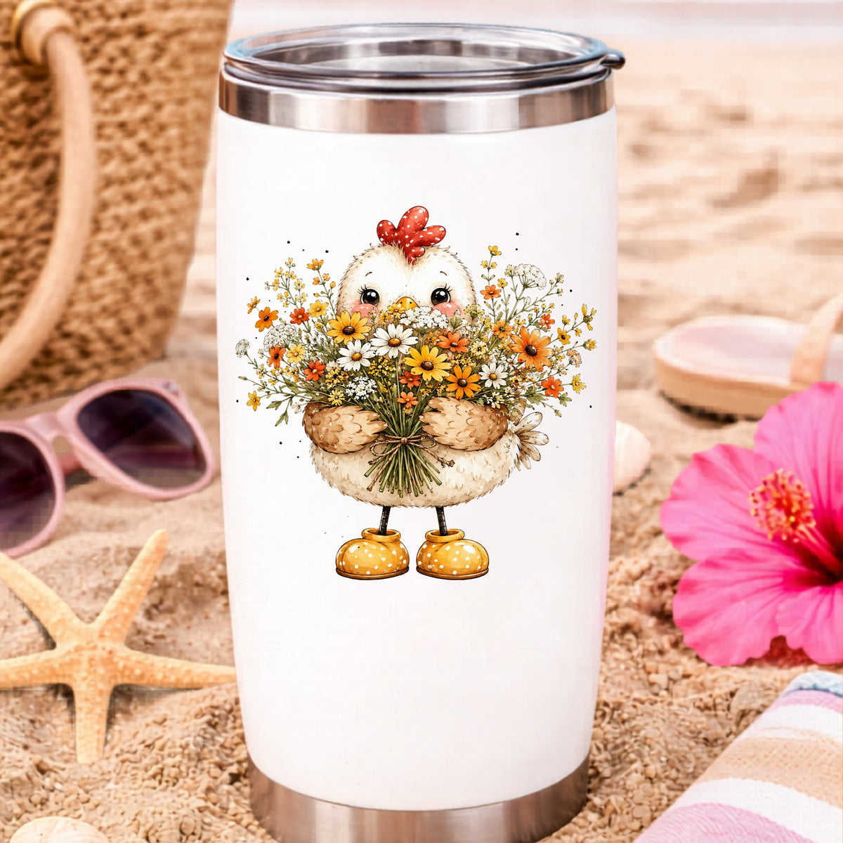 Chicken Holding Wildflower Bouquet UV DTF sticker applied to a white travel tumbler on beach sand