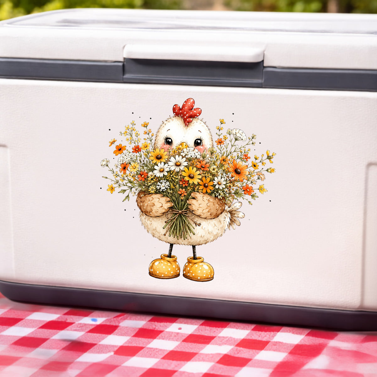 Chicken Holding Wildflower Bouquet UV DTF sticker applied to a white cooler on a red gingham cloth