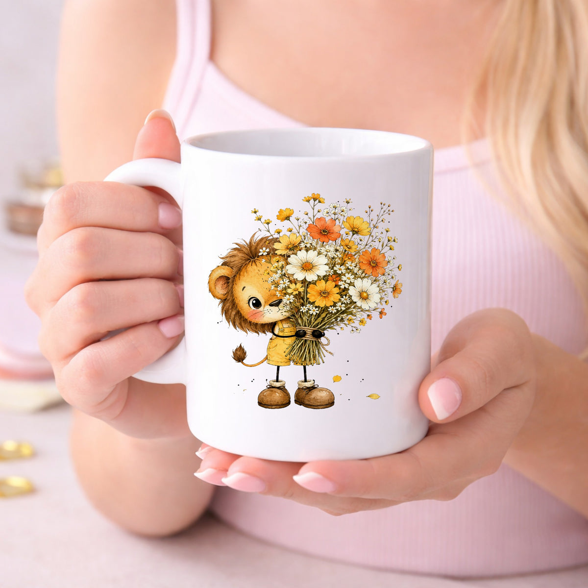 Baby Lion Holding Wildflower Bouquet UV DTF sticker applied to a white coffee mug held in both hands