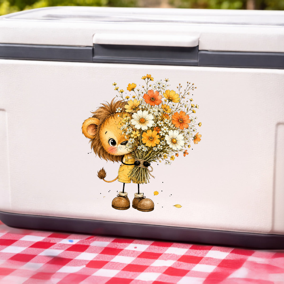 Baby Lion Holding Wildflower Bouquet UV DTF sticker applied to a white cooler on a red gingham cloth