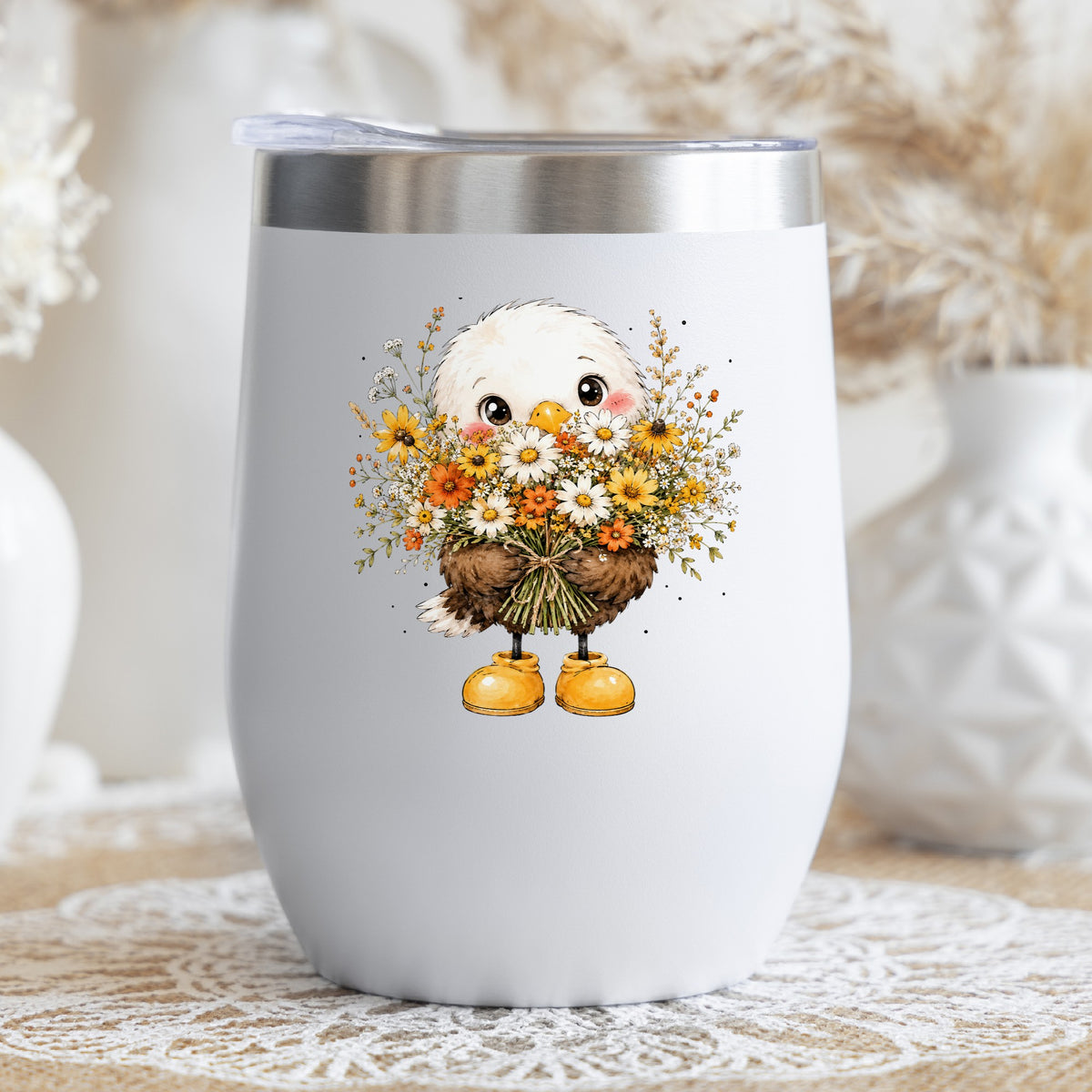 Baby Eagle Holding Daisy Bouquet UV DTF sticker applied to a white stemless tumbler with a lid