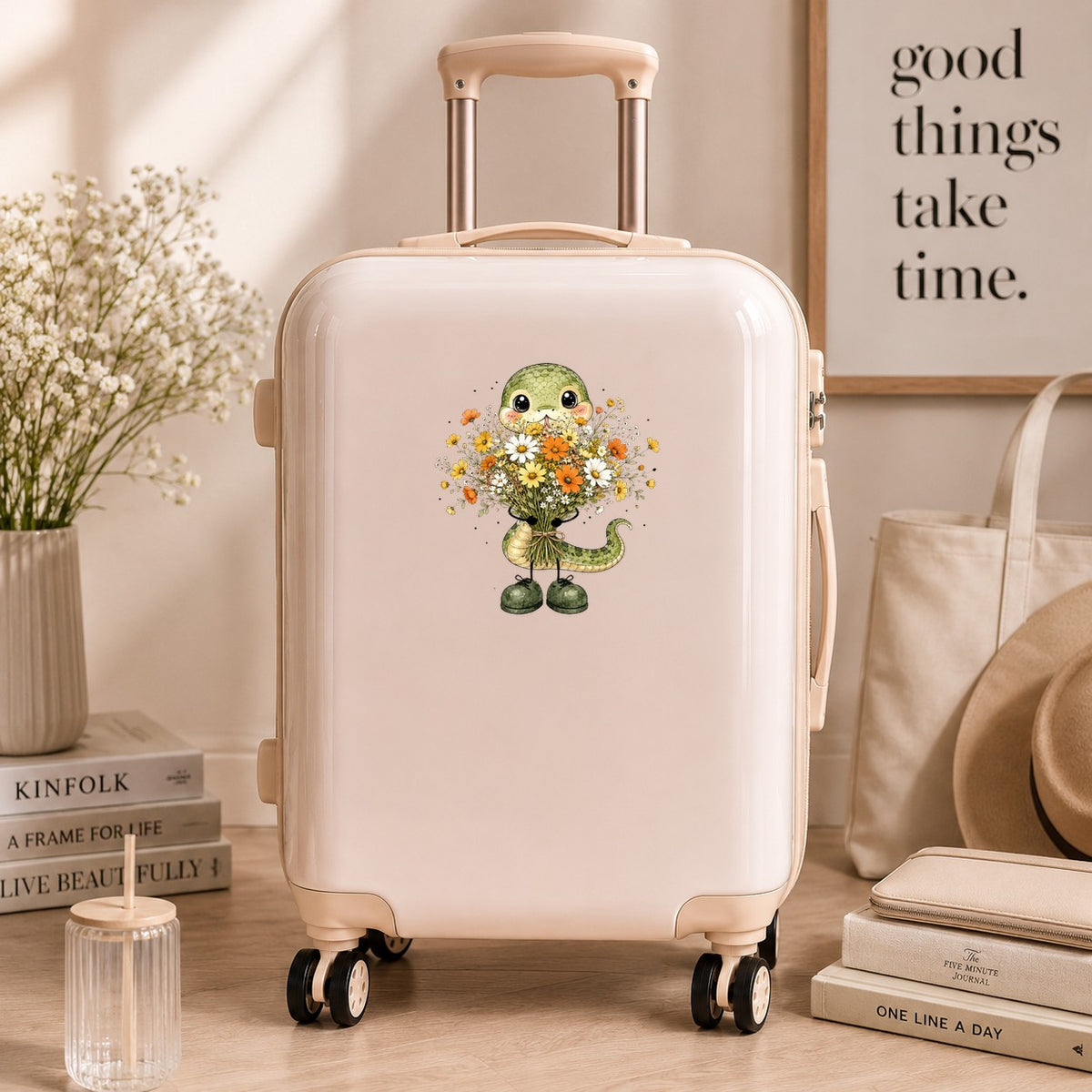 Green Snake Holding Wildflower Bouquet UV DTF sticker applied to a cream carry-on suitcase