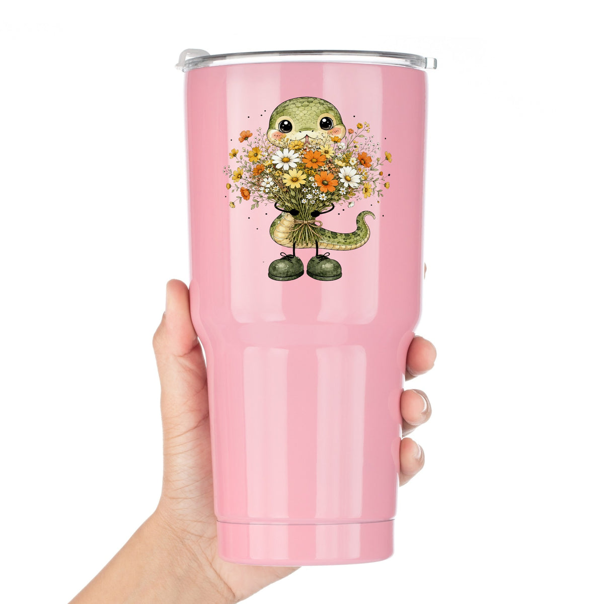 Green Snake Holding Wildflower Bouquet UV DTF sticker applied to a pink tumbler held against a white background