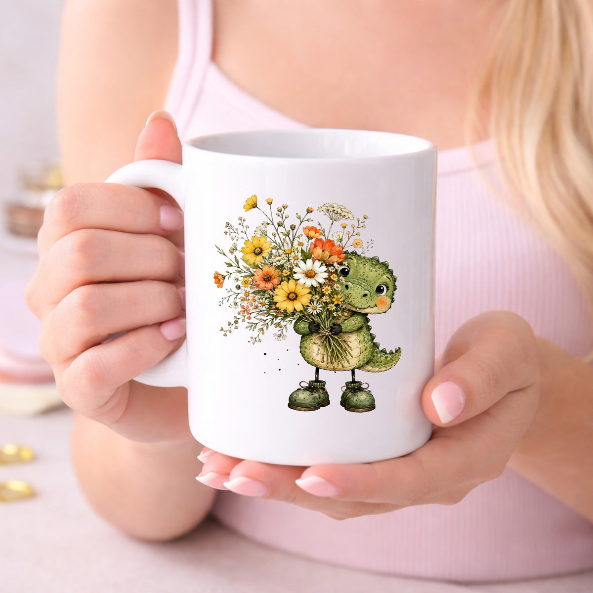 Baby Crocodile Holding Flower Bouquet UV DTF sticker applied to a white coffee mug held in both hands