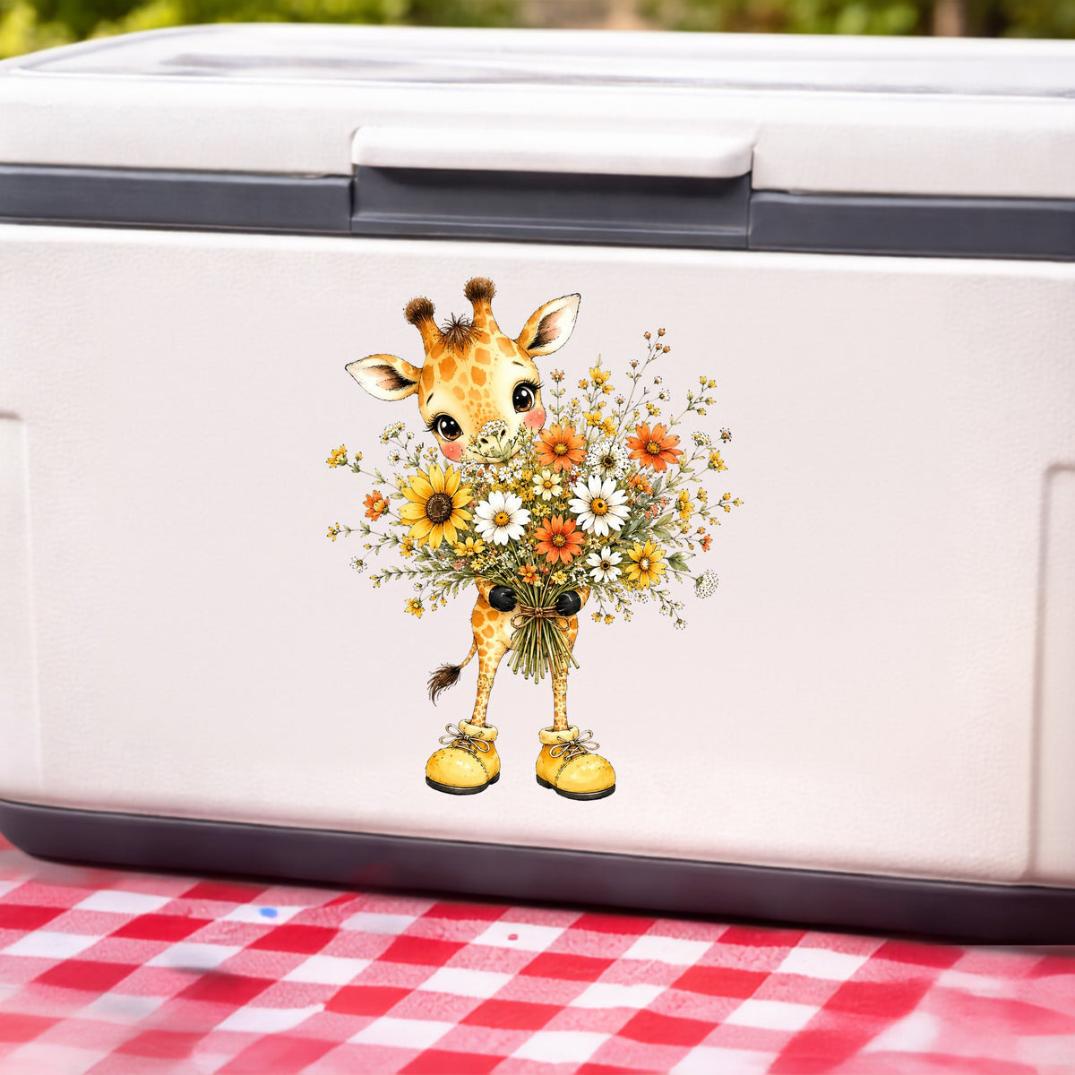 Giraffe Holding Sunflower Bouquet UV DTF sticker applied to a white cooler on a red gingham cloth