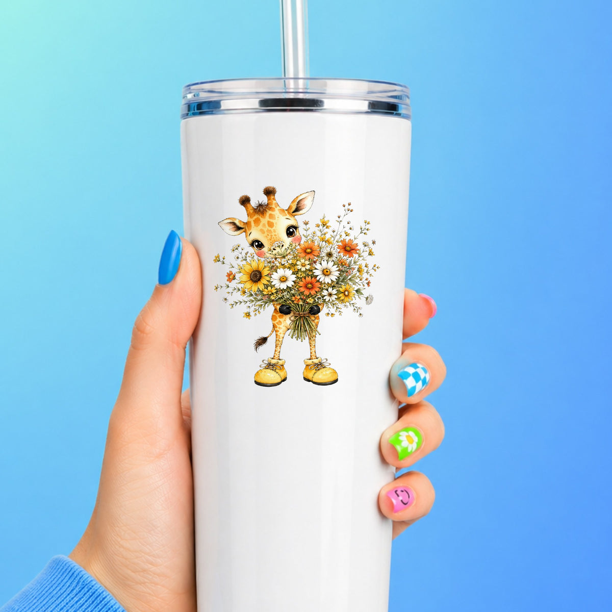 Giraffe Holding Sunflower Bouquet UV DTF sticker applied to a white straw tumbler on a blue background