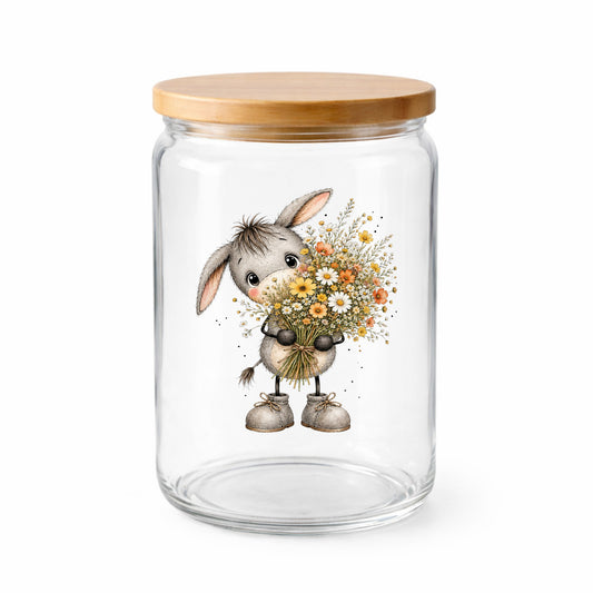 Baby Donkey Holding Wildflower Bouquet UV DTF sticker applied to a clear glass jar with a wooden lid